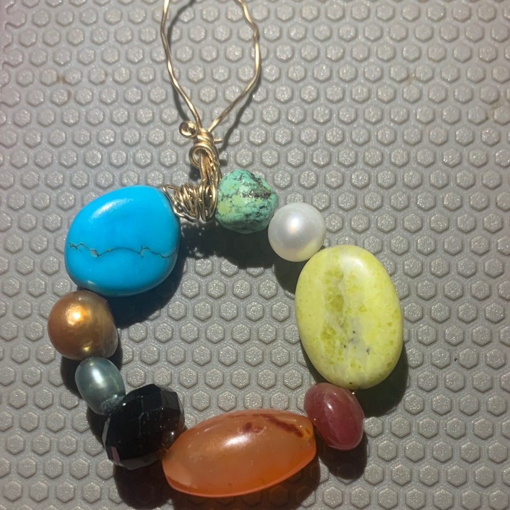 14k gold wire pendant with assorted gemstones